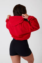 Load image into Gallery viewer, A woman facing back wearing True Form UK Womens Red Oversized Crop Hoodie for Gym
