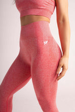 Load image into Gallery viewer, A woman wearing true form Coral leggings 
