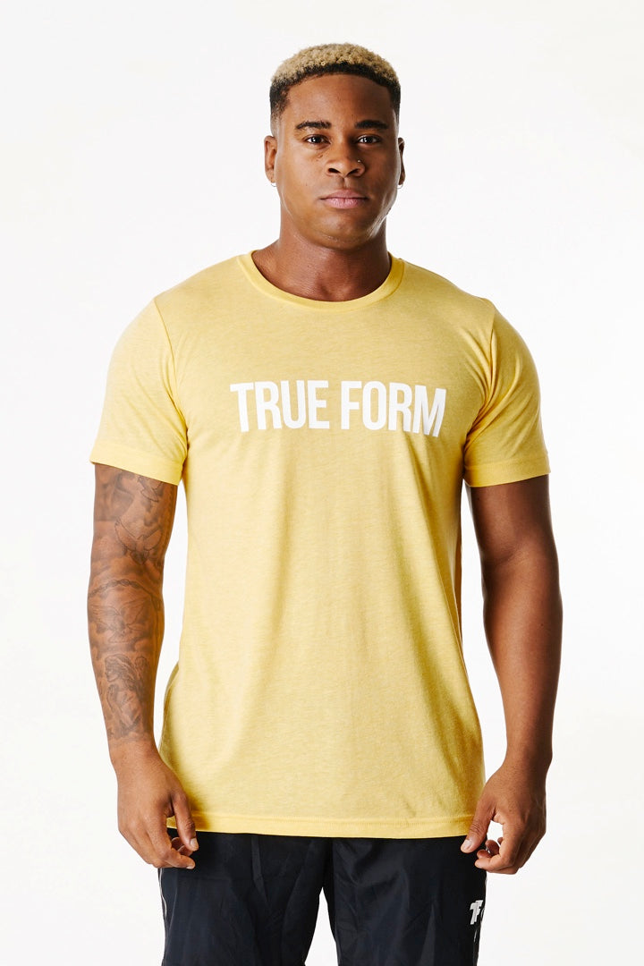 A man wearing True form UK Unisex Lemon colour Tshirt