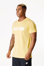 Load image into Gallery viewer, A man wearing True form UK Unisex yellow Tshirt
