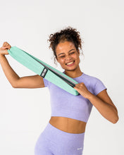 Load image into Gallery viewer, A woman Stretching True Form Light Resistance Gym Band
