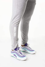 Load image into Gallery viewer, Men wearing Tapered Grey Joggers for gym wear by true form uk
