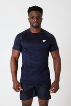 Load image into Gallery viewer, A man standing facing front wearing true form black embossed T-shirt
