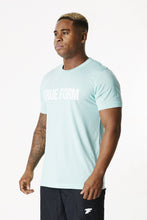 Load image into Gallery viewer, a man wearing unisex tshirt of gym clothing brand true form uk
