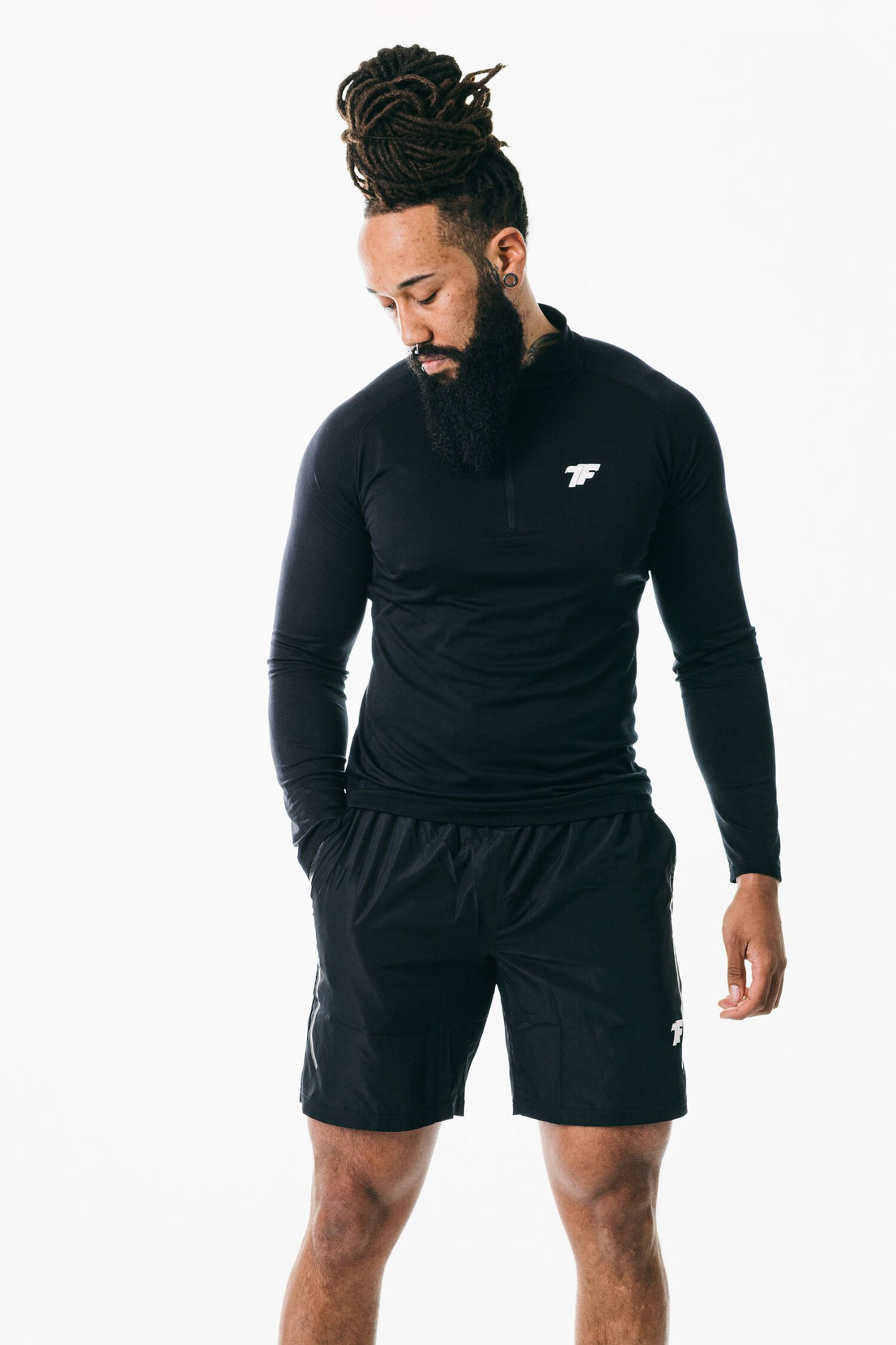 A bearded man wearing True Form UK Black Muscle Fit Zip Tshirt for Gym