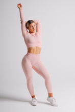 Load image into Gallery viewer, Lady Wearing True Form Baby Pink Ribbed Leggings in UK
