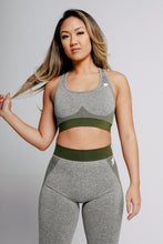 Load image into Gallery viewer, A woman wearing True Form Olive Sports Gym Bra and gym legging

